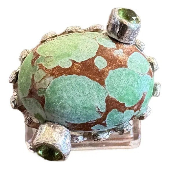 Turquoise Ring in a Crown Shaped Sterling Silver Setting With Two Peridot Gemstones