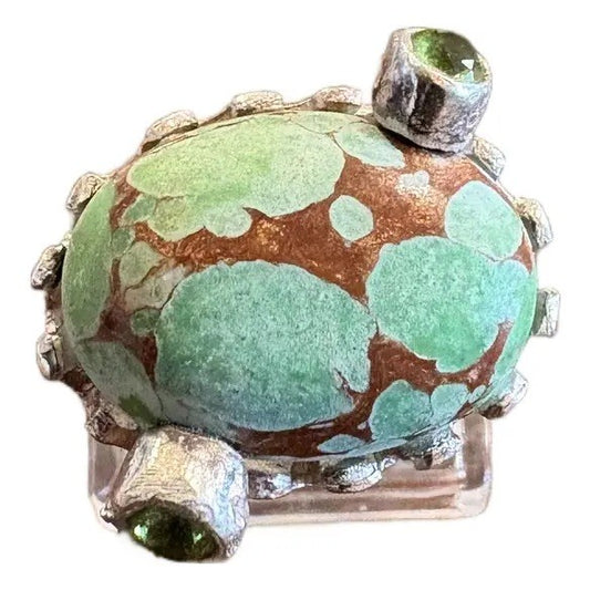 Turquoise Ring in a Crown Shaped Sterling Silver Setting With Two Peridot Gemstones