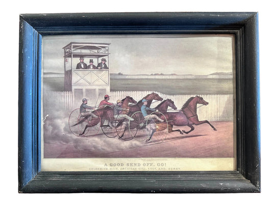 Framed print of a horse race scene with horses and riders on a track.